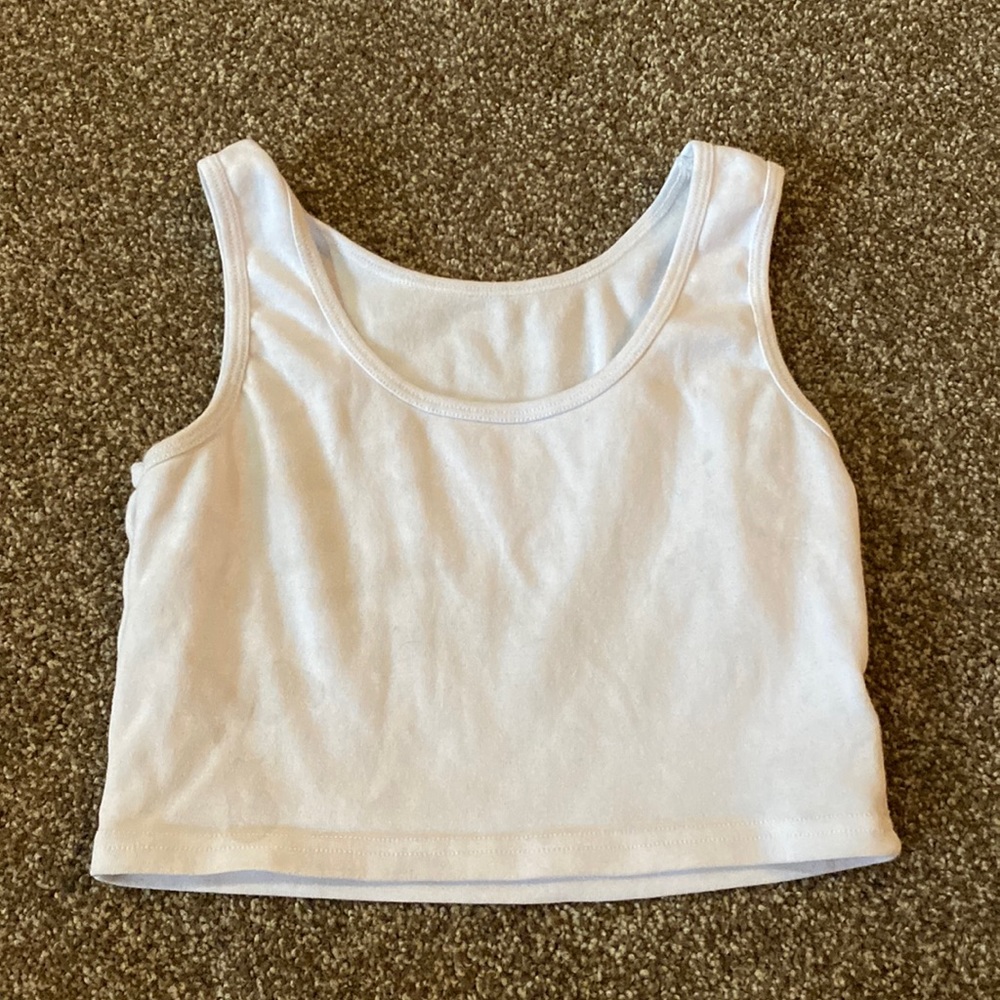 It is a cropped tank top, it is size Small, and it is white.